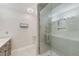 Modern bathroom with glass-enclosed shower, sleek fixtures and stylish decor at 921 Woodland Dr, Palm Harbor, FL 34683