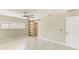 Bedroom with a modern ceiling fan, window and sliding barn door closet at 921 Woodland Dr, Palm Harbor, FL 34683