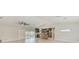 Open concept kitchen with stainless steel appliances, tile floors and sliding glass doors to the backyard at 921 Woodland Dr, Palm Harbor, FL 34683