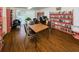 Cozy library with comfortable seating, a desk, and extensive bookshelves filled with reading material at 938 Virginia St # 308, Dunedin, FL 34698