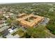 Aerial view showcases the condo's courtyard pool, parking, landscaping, and nearby residential neighborhood at 12760 Indian Rocks Rd # 571, Largo, FL 33774