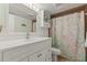 Bathroom featuring a vanity, tiled floors, shower curtain and a large mirror at 12760 Indian Rocks Rd # 571, Largo, FL 33774
