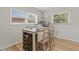Dining area featuring a table with a built-in wine rack and seating for four at 12760 Indian Rocks Rd # 571, Largo, FL 33774