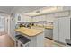 Bright kitchen with a breakfast bar, updated appliances, and ample counter space at 12760 Indian Rocks Rd # 571, Largo, FL 33774