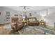 Relaxing living room with recliners, a coastal rug, and ample natural light at 12760 Indian Rocks Rd # 571, Largo, FL 33774