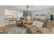 Comfortable living room with open sight lines to the dining area and kitchen at 12760 Indian Rocks Rd # 571, Largo, FL 33774