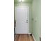 Front door with green walls and hard wood floors at 100 4Th S Ave # 207, St Petersburg, FL 33701