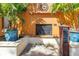 Charming outdoor fireplace detail showcasing cozy ambiance and landscaping at 100 4Th S Ave # 207, St Petersburg, FL 33701