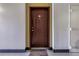 Apartment front door in hallway with brown door and home doormat at 100 4Th S Ave # 207, St Petersburg, FL 33701
