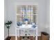 Bright home office with a white desk and a window view, creating an inviting workspace at 100 4Th S Ave # 207, St Petersburg, FL 33701