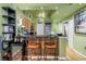 Open-concept kitchen with wood cabinets, granite countertops, stainless steel appliances, and bar seating at 100 4Th S Ave # 207, St Petersburg, FL 33701