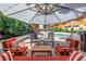 Expansive patio area boasts comfortable seating and shade umbrellas with a pool view at 100 4Th S Ave # 207, St Petersburg, FL 33701