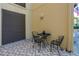 Cozy outdoor seating area with minimalist metal table and mature landscaping at 100 4Th S Ave # 207, St Petersburg, FL 33701