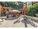 Inviting patio space features an outdoor seating area with lush landscaping in a condominium complex at 100 4Th S Ave # 207, St Petersburg, FL 33701