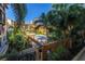 Attractive view of a community pool surrounded by palm trees and lush landscaping at 100 4Th S Ave # 207, St Petersburg, FL 33701