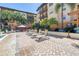 Inviting pool deck with lounge chairs, umbrellas, and a gazebo, perfect for soaking up the sun and enjoying the community at 100 4Th S Ave # 207, St Petersburg, FL 33701