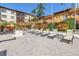 Relaxing poolside with lounge chairs and a gazebo, surrounded by lush landscaping and vibrant flowers at 100 4Th S Ave # 207, St Petersburg, FL 33701