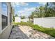 Fenced backyard includes a brick-paved area and an exterior shed at 1000 8Th Sw Ave, Largo, FL 33770