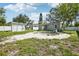 Backyard area featuring a round paver area and a shed at 1000 8Th Sw Ave, Largo, FL 33770