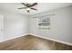 Bedroom featuring a ceiling fan and a window providing natural light at 1000 8Th Sw Ave, Largo, FL 33770