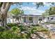 Charming home featuring a neutral color scheme, well-maintained landscaping, and inviting curb appeal at 1000 8Th Sw Ave, Largo, FL 33770