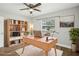 Bright home office space featuring sleek wooden furniture and a ceiling fan for added comfort at 1000 8Th Sw Ave, Largo, FL 33770