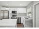 Updated kitchen boasting stainless steel appliances, white cabinets, and attractive backsplash at 1000 8Th Sw Ave, Largo, FL 33770