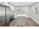 Updated kitchen boasting stainless steel appliances and sleek white cabinetry at 1000 8Th Sw Ave, Largo, FL 33770