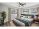 Comfortable main bedroom boasts soft lighting and a decorative wall print at 1000 8Th Sw Ave, Largo, FL 33770