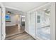 Bright sun room with wood floors, sliding glass doors, and neutral colors at 1000 8Th Sw Ave, Largo, FL 33770