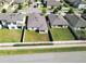 An aerial view shows the backyard and neighborhood at 1001 Culbreath Green Ct, Ruskin, FL 33570