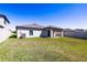 The home's backyard is fully fenced in and has a covered patio at 1001 Culbreath Green Ct, Ruskin, FL 33570