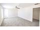 This airy bedroom has neutral carpet, ceiling fan, and a walk-in closet at 1001 Culbreath Green Ct, Ruskin, FL 33570
