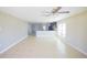 Open-concept living area boasts neutral paint, tile floors, and an open layout, perfect for Gathering gatherings at 1001 Culbreath Green Ct, Ruskin, FL 33570