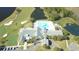 Aerial view of the clubhouse, pool, golf course, and surrounding landscaping in the community at 10048 Cleghorn Dr, San Antonio, FL 33576