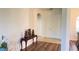 Inviting foyer with wood flooring, arched doorways, and decorative table at 10048 Cleghorn Dr, San Antonio, FL 33576