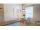 Eat-in kitchen with glass table, modern chairs, and granite countertop, ideal for relaxed dining at 10048 Cleghorn Dr, San Antonio, FL 33576