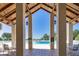 View of the community swimming pool and sun deck with tiled flooring and shaded seating areas at 10048 Cleghorn Dr, San Antonio, FL 33576