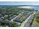 Aerial view of a community near the water with mature trees at 1010 Mango Ct, Oldsmar, FL 34677
