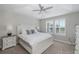 Bright bedroom with plush carpet, neutral tones, and large windows with plantation shutters at 1010 Mango Ct, Oldsmar, FL 34677