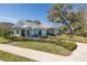 Community clubhouse showcasing its architecture, landscaping, and nearby waterfront location at 1010 Mango Ct, Oldsmar, FL 34677