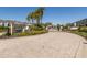 Entrance sign to Bayside Terrace with paving stones and lush plants at 1010 Mango Ct, Oldsmar, FL 34677