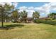 Well-maintained backyard featuring green grass and neatly trimmed hedges offering privacy at 10612 Glencorse Ter, Bradenton, FL 34211