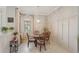 Cozy dining area with decorative lighting, and views of the lovely neighborhood at 10612 Glencorse Ter, Bradenton, FL 34211