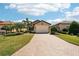 Charming single-story home with a well-manicured lawn and beautiful landscaping at 10612 Glencorse Ter, Bradenton, FL 34211