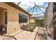 Screened lanai featuring brick floors and outdoor furniture, perfect for enjoying the outdoors at 10612 Glencorse Ter, Bradenton, FL 34211