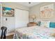 Cozy bedroom with seaside decor, neutral walls, and a ceiling fan at 11012 Ashbourne Cir, Tampa, FL 33624