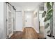 Inviting foyer with hardwood floors, ample natural light, and sliding barn door, perfect for welcoming guests at 11012 Ashbourne Cir, Tampa, FL 33624