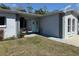 Inviting front porch with seating, decorative wreath, and fresh plants create a welcoming entry at 11803 127Th Ave, Largo, FL 33778