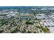 Expansive aerial shot showcasing a vibrant neighborhood with water features and lush surroundings at 12140 74Th St, Largo, FL 33773